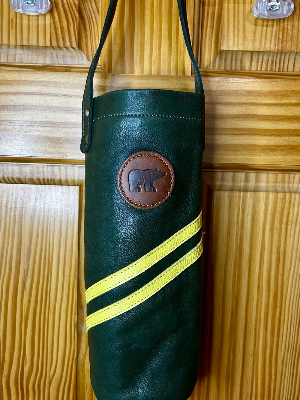 Green Leather Bottle Carrier with Yellow Stripes and Bear Patch